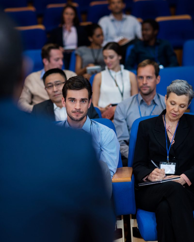 Business executives participating in a business meeting at conference center